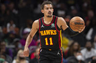 Atlanta Hawks guard Trae Young (11) dribbles up court during the first half of an NBA basketball game against the New York Knicks Saturday, Nov. 27, 2021, in Atlanta. (AP Photo/Hakim Wright Sr.)