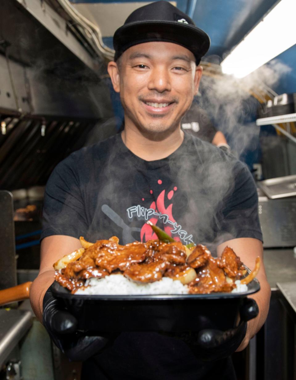 Chef Tony Banawa is bringing his interpretation of classic Asian dishes to the Garden at Palafox and Main. Banawa, the Flip-N-Yaki food truck owner, is kicking off the new year by offering fast Asian favorites from the grill on Monday, Jan. 3, 2021. 
The Flip-N-Yaki food truck is kicking off the new year by offering fast Asian favorites from the grill on Monday, Jan. 3, 2021.