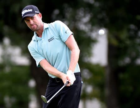 Aug 18, 2017; Greensboro, NC, USA; Webb Simpson hits a chip shot on the ninth hole during the second round of the Wyndham Championship golf tournament at Sedgefield Country Club. Mandatory Credit: Rob Kinnan-USA TODAY Sports