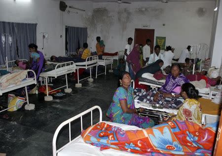 Women who underwent botched sterilization surgeries at a government mass sterilization "camp" receive treatment at a district hospital in Bilaspur, in Chhattisgarh, November 10, 2014. REUTERS/Stringer