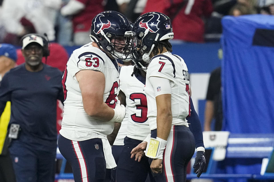 Houston Texans quarterback C.J. Stroud (7) celebrates his touchdown pass with center Michael Deiter (63) during the first half of an NFL football game Saturday, Jan. 6, 2024, in Indianapolis. (AP Photo/Darron Cummings)