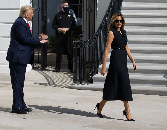 WASHINGTON, DC – OCTOBER 22: President Donald Trump and First Lady Melania Trump walk to the South Lawn to depart the White House on October 22, 2020 in Washington, DC. President Trump travels to Nashville, Tennessee for the final debate with Democratic presidential nominee Joe Biden. The Commission on Presidential Debates changed the format this time, muting of microphones to start each of Thursday’s debate segments. (Photo by Tasos Katopodis/Getty Images)