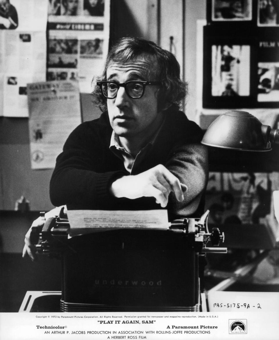 Woody Allen with his arms resting on a typewriter in a scene from the film 'Play It Again, Sam', 1972. (Photo by Paramount/Getty Images)