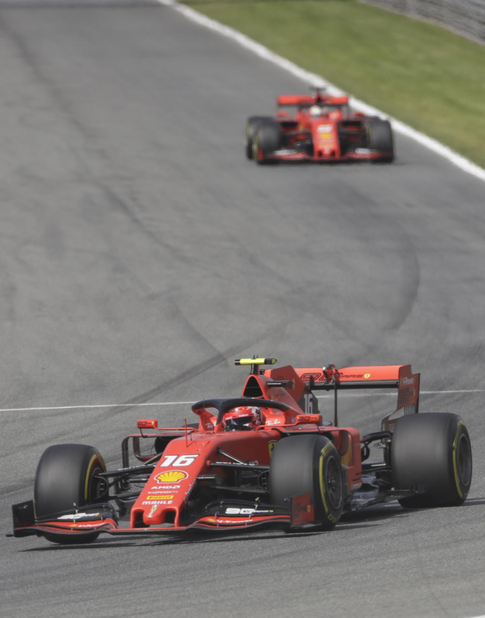 Ferrari driver Charles Leclerc of Monaco leads Ferrari driver Sebastian Vettel of Germany during the qualifying session at the Monza racetrack, in Monza, Italy, Saturday, Sept. 7, 2019. The Formula one race will be held on Sunday. (AP Photo/Luca Bruno)