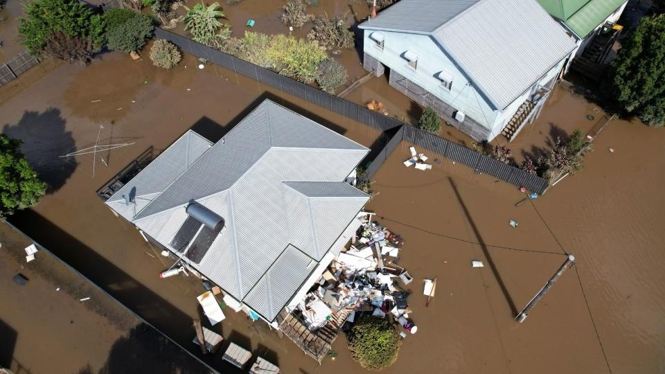 House in flood waters, aerial shot