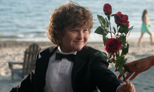 <p>OK, so this kid is neither a hottie nor a hunk.....but come on! As if a little kid in a tux holding roses doesn't make your heart melt?</p>