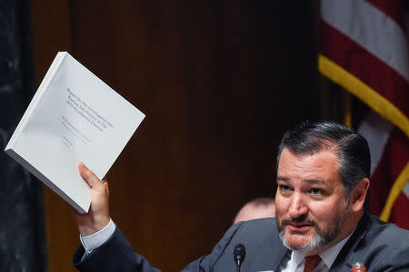 U.S. Senator Ted Cruz (R-TX) holds up a copy of the report from Special Counsel Robert Mueller as he questions Attorney General William Barr during a hearing on "the Justice Department's investigation of Russian interference with the 2016 presidential election" on Capitol Hill in Washington, U.S., May 1, 2019. REUTERS/Clodagh Kilcoyne