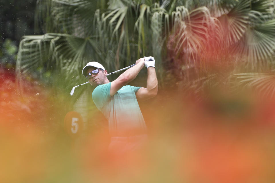 Paul Casey of England follows his shot on the eighth hole during round two of the CIMB Classic golf tournament at Tournament Players Club (TPC) in Kuala Lumpur, Malaysia, Friday, Oct. 12, 2018. (AP Photo/Yam G-Jun)