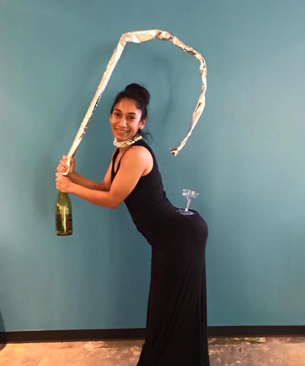 girl in a black dress with a champagne bottle