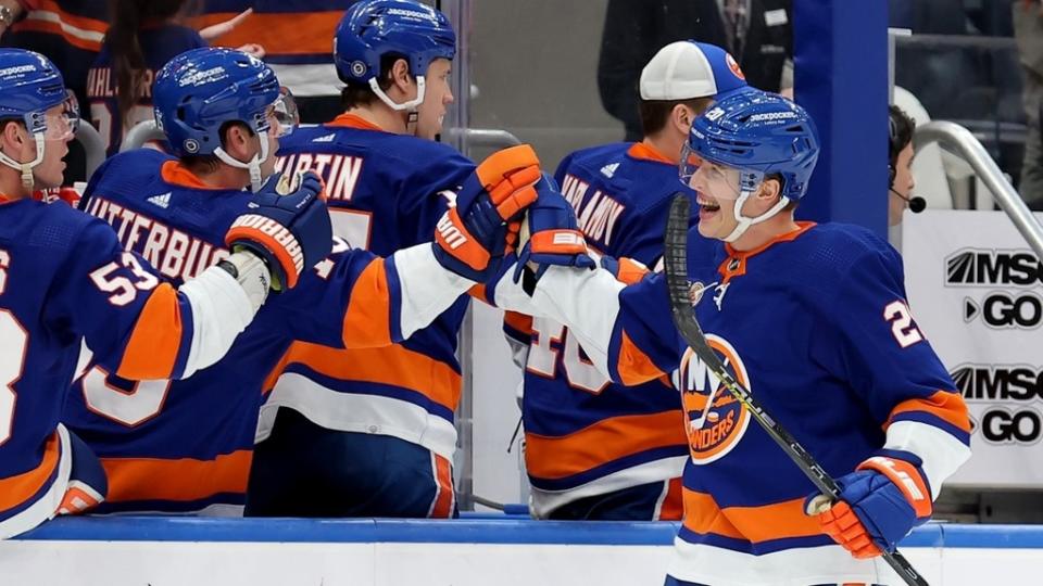 Apr 12, 2023; Elmont, New York, USA; New York Islanders right wing Hudson Fasching (20) celebrates his goal against the Montreal Canadiens with teammates during the first period at UBS Arena.