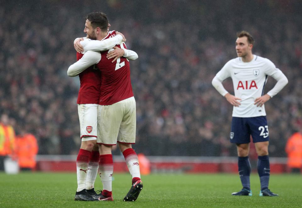 Arsenal’s Nacho Monreal (left) and Shkodran Mustafi celebrate victory over Tottenham