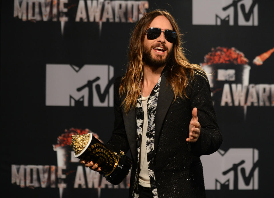 Jared Leto poses in the press room with the award for Best On-Screen Transformation for "Dallas Buyers Club" at the MTV Movie Awards on Sunday, April 13, 2014, at Nokia Theatre in Los Angeles. (Photo by Jordan Strauss/Invision/AP)