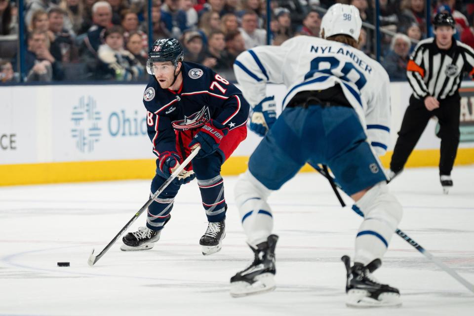 Dec 23, 2023; Columbus, Ohio, USA;
Columbus Blue Jackets defenseman Damon Severson (78) looks for an open pass around Toronto Maple Leafs right wing William Nylander (88) during the first period of their game on Saturday, Dec. 23, 2023 at Nationwide Arena.