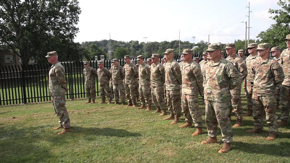 Col. Timothy Schubert and soldiers of the 278th Army National Guard Regiment stand at attention during a July 16, 2023, ceremony unveiling a historical marker to Medal of Honor recipients from an affiliated unit near the National Guard Armory off Sutherland Avenue.
