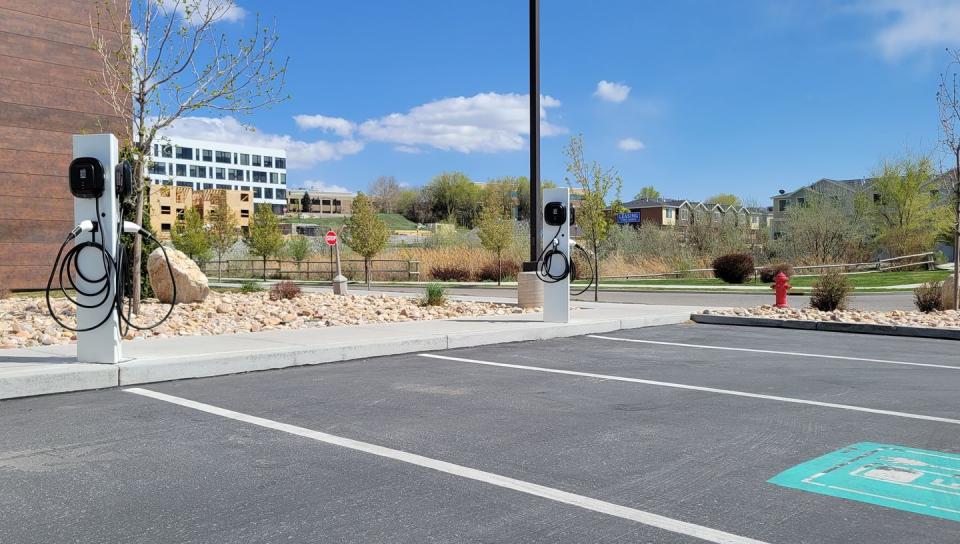 a parking lot with ev passport chargers ready for customers