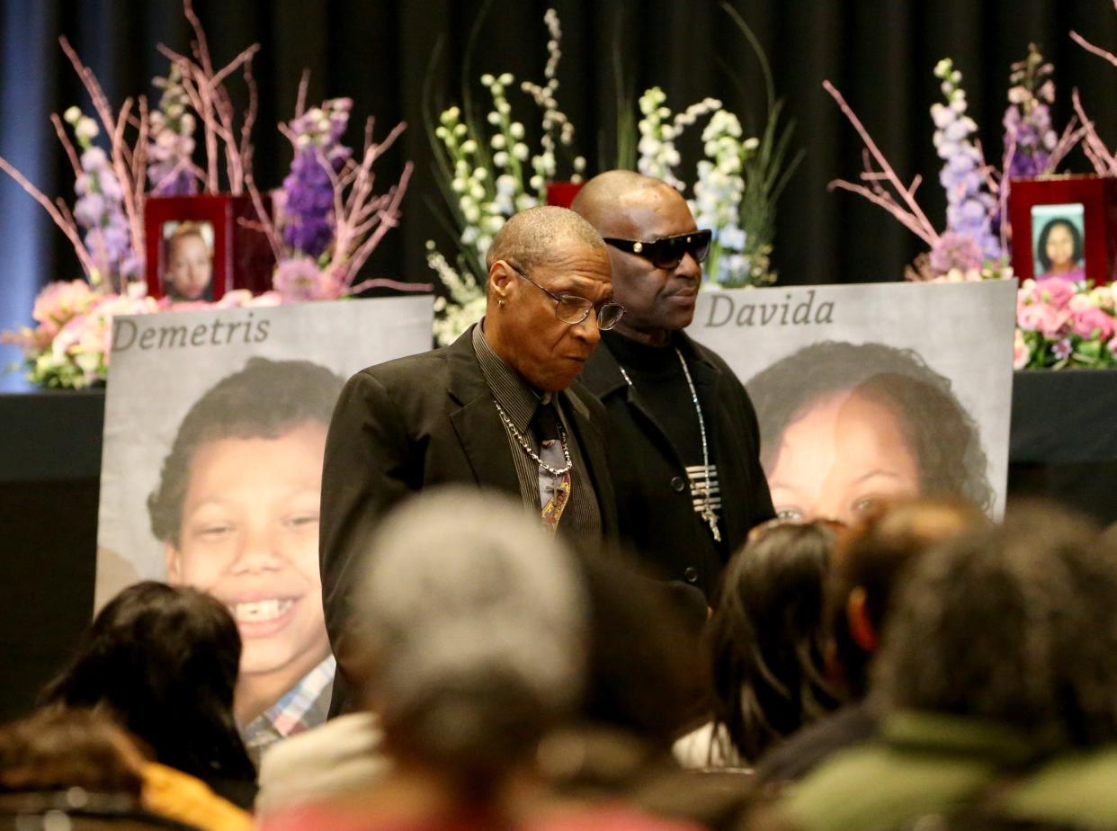 David Smith, left, walks to his seat Monday, Feb. 5, 2024, at a memorial service at Century Center in South Bend for his six children who died as a result of the Jan. 21, 2024, fatal house fire on North LaPorte Avenue.