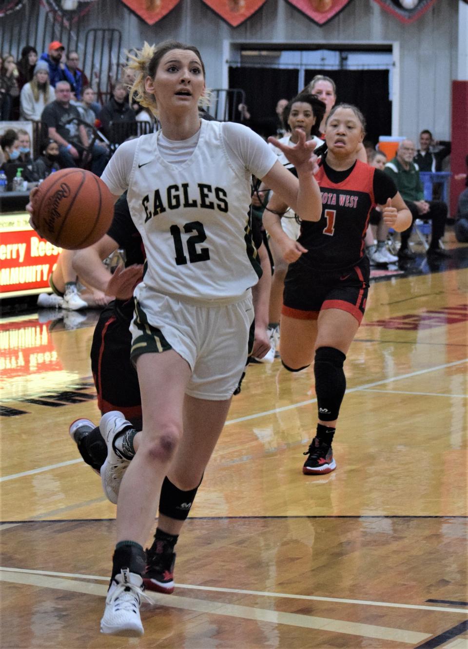 GlenOak forward Kiley Dyrlund drives past the Lakota West defense in the Classic in the Country at Hiland High School, Jan. 16, 2022.