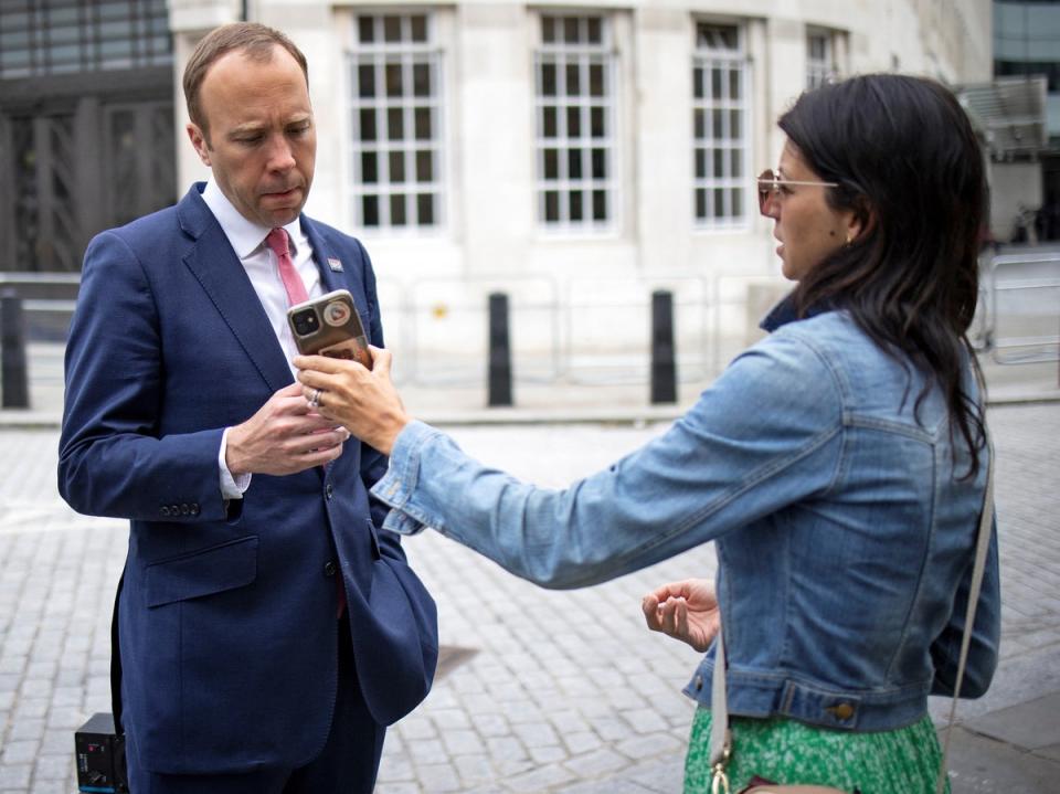 Matt Hancock and Gina Coladangelo pictured as they leave the BBC in London on 6 June 2021 (AFP via Getty Images)