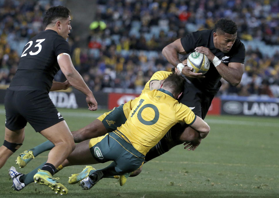 New Zealand's Waisake Naholo, right, is brought down by Australia's Bernard Foley during their rugby union test match in Sydney, Saturday, Aug. 18, 2018. (AP Photo/Rick Rycroft)