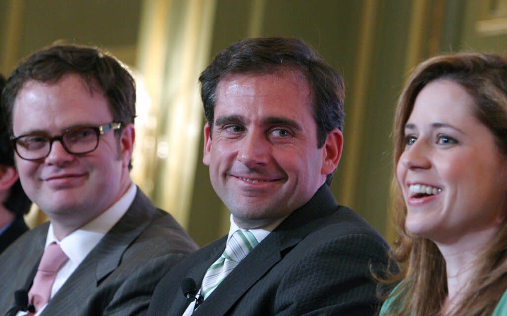 Steve Carell, center, and Rainn Wilson, left, look at Jenna Fischer, right, as she talks about her character on the NBC series "The Office."