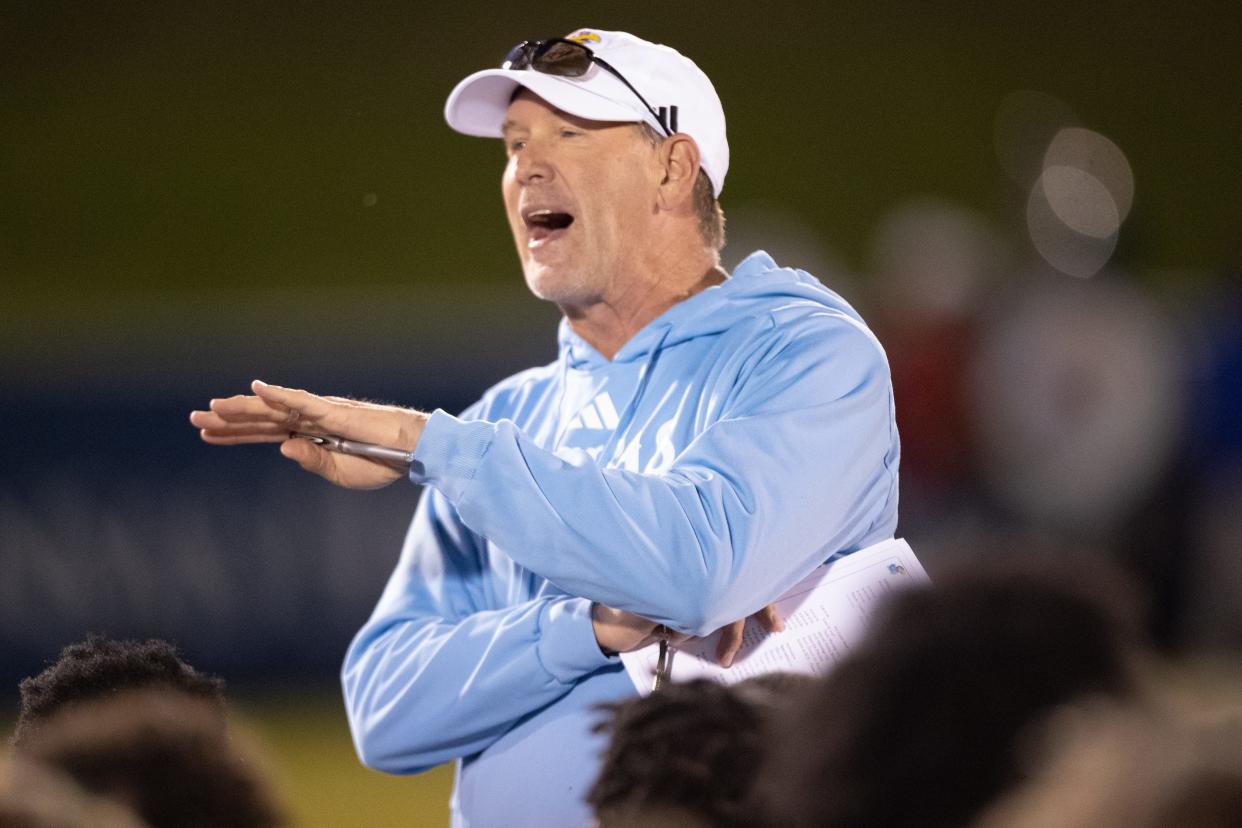 Kansas football coach Lance Leipold speaks with his team following Friday's spring showcase event at Rock Chalk Park.