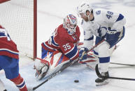 Montreal Canadiens goaltender Sam Montembeault stops Tampa Bay Lightning's Nick Perbix (48) during the second period of an NHL hockey game Tuesday, March 21, 2023, in Montreal. (Graham Hughes/The Canadian Press via AP)