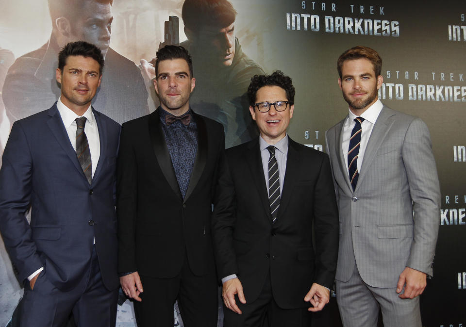 Cast members Karl Urban (L), Zachary Quinto (2nd L) and Chris Pine (R) pose with director J.J. Abrams at the red carpet of  the Australian premiere of "Star Trek Into Darkness" in central Sydney April 23, 2013. REUTERS/Daniel Munoz (AUSTRALIA - Tags: ENTERTAINMENT SOCIETY)