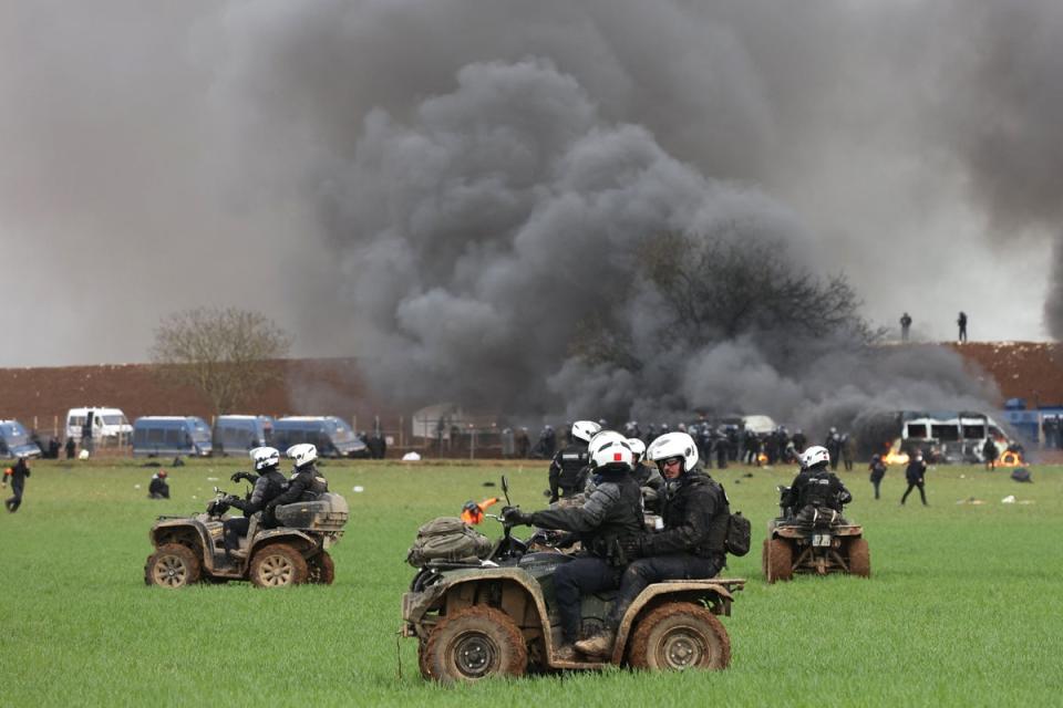 Riot mobile gendarmes, riding quad bikes, fire teargas shells towards protesters during the demonstration (AFP)