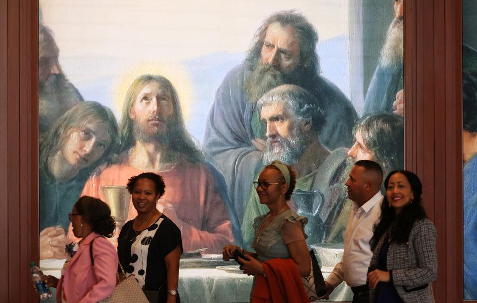 Attendees walk past art work during the 193rd Semiannual General Conference of The Church of Jesus Christ of Latter-day Saints at the Conference Center in Salt Lake City on Saturday, Sept. 30, 2023. | Jeffrey D. Allred, Deseret News