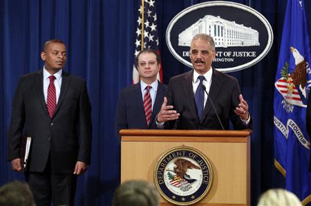 U.S. Attorney General Eric Holder speaks at a news conference at the Justice Department in Washington March 19, 2014. REUTERS/Yuri Gripas