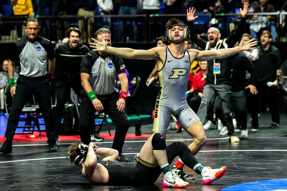 Purdue's Matt Ramos celebrates after pinning Iowa's Spencer Lee at 125 pounds in the semifinals during the fourth session of the NCAA Division I Wrestling Championships, Friday, March 17, 2023, at BOK Center in Tulsa, Okla.