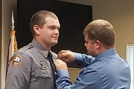 Daytona Beach police officer Jason Raynor participates in his swearing-in ceremony in 2019.