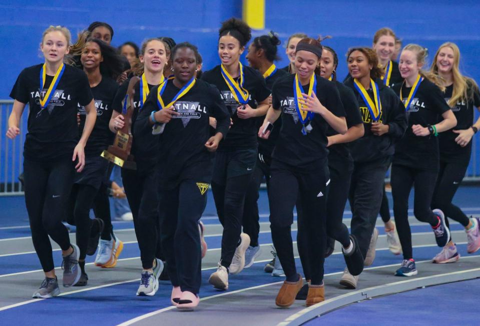 Tatnall takes a victory lap after winning the girls's team title during the DIAA indoor track and field championships at the Prince George's Sports and Learning Complex in Landover, Md., Saturday, Feb. 3, 2023.