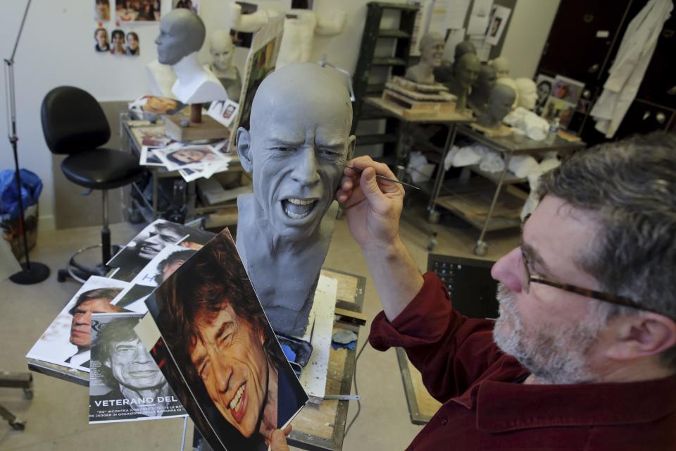 Paris Grevin museum sculptor Eric Saint Chaffray works on the head of Rolling Stones lead singer Mick Jagger at their workshop in Paris