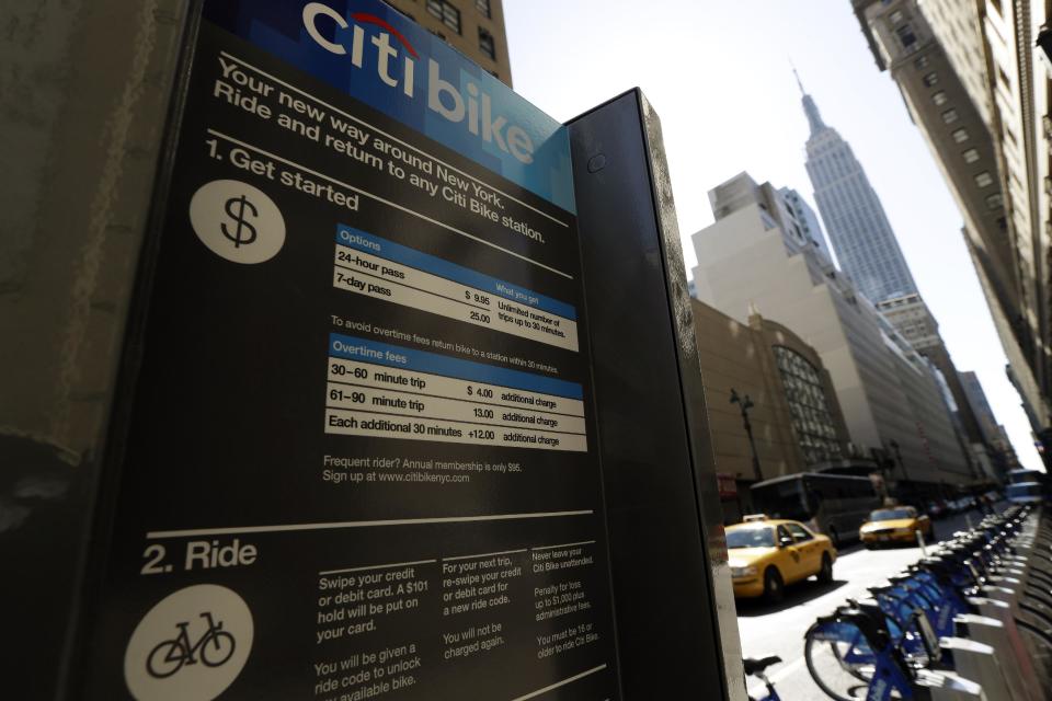 Bikes sit at a docking station as part of a bike share program Monday, May 27, 2013, in New York. The privately funded Citi Bike bike-share program will launch with 6,000 bikes at 330 docking stations in Manhattan and parts of Brooklyn. Officials hope to expand to 10,000 bikes and 600 docking stations in Manhattan, Brooklyn and Queens. (AP Photo/Frank Franklin II)