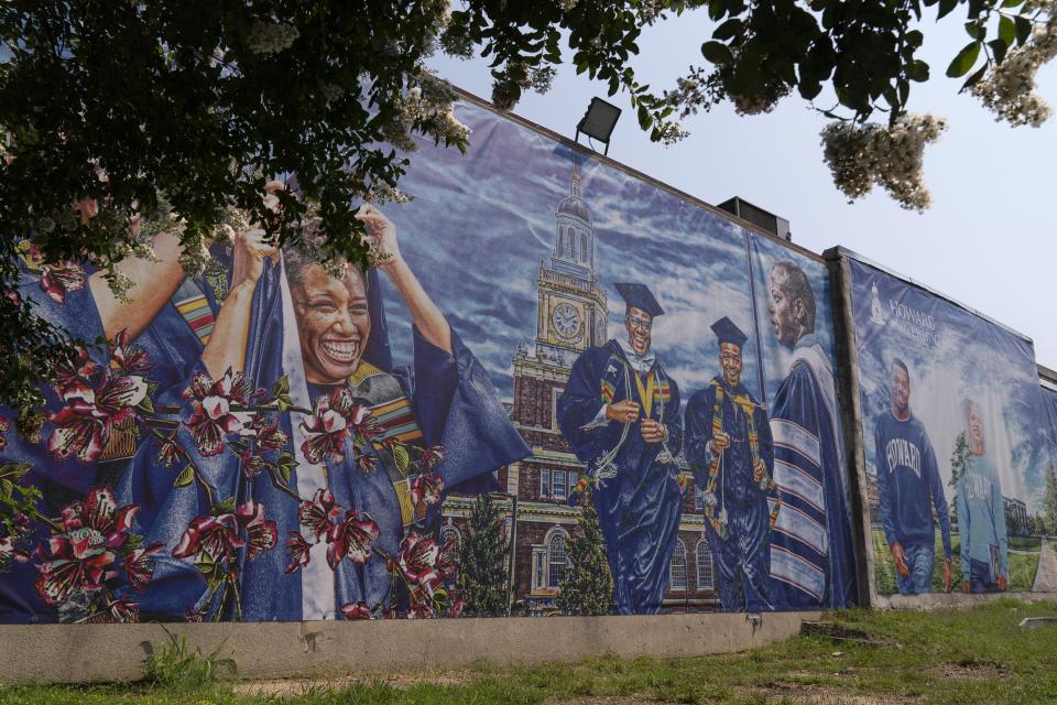 FILE - A graduation themed printed mural is seen on the Howard University campus, July 6, 2021, in Washington. More than a third of America’s 101 historically Black colleges and universities have been targeted by calls or emails threatening bombings since early January. Howard University in Washington has received at least four threats since Jan. 4. (AP Photo/Jacquelyn Martin)