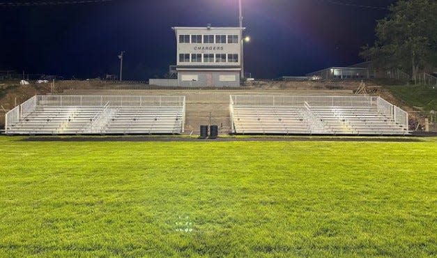 Temporary aluminum stands were installed Tuesday night on the north side track at Alumni stadium. The seating will be used for all home Union City Charger football games.