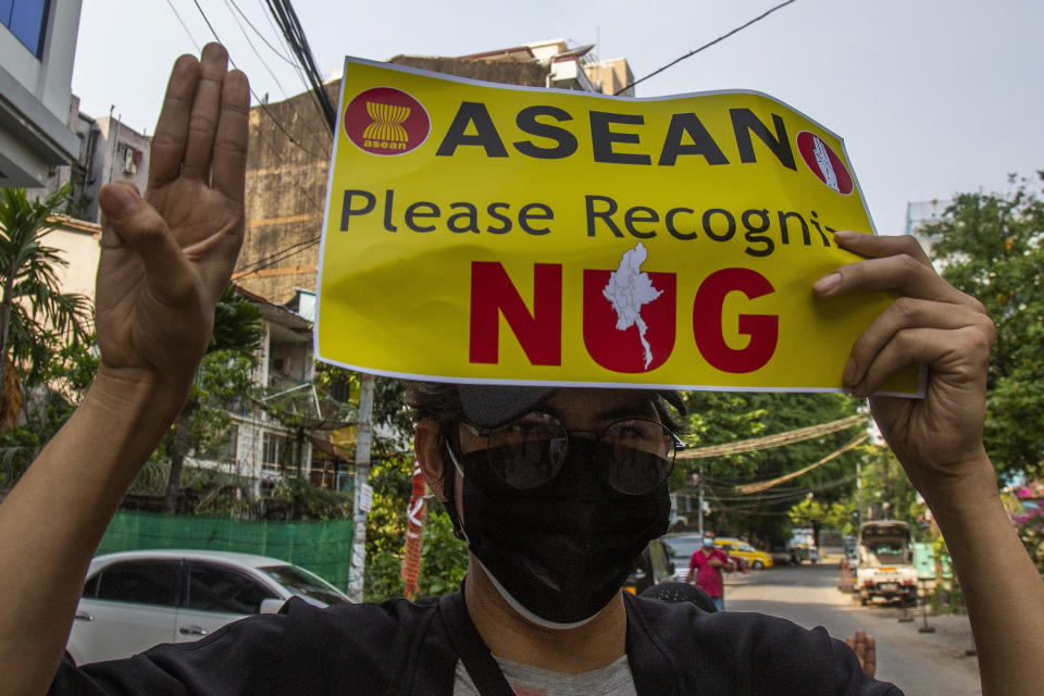 An anti-coup protester flashes the three-finger salute during the demonstration against the military coup in Yangon, Myanmar, on Friday, April 23, 2021. Leaders of the 10-member Association of Southeast Asian Nations meet Saturday, April 24, in Jakarta to consider plans to promote a peaceful resolution of the conflict that has wracked Myanmar since its military launched a deadly crackdown on opponents to its seizure of power in February. (AP Photo)