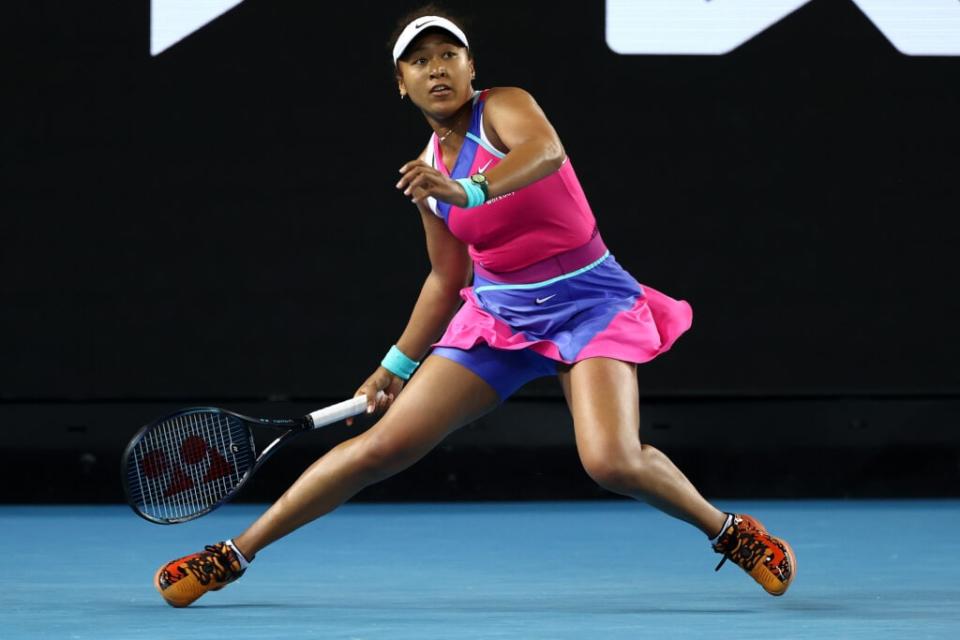 MELBOURNE, AUSTRALIA – JANUARY 21: Naomi Osaka of Japan plays a forehand in her third round singles match against Amanda Anisimova of United States during day five of the 2022 Australian Open at Melbourne Park on January 21, 2022 in Melbourne, Australia. (Photo by Mark Metcalfe/Getty Images)