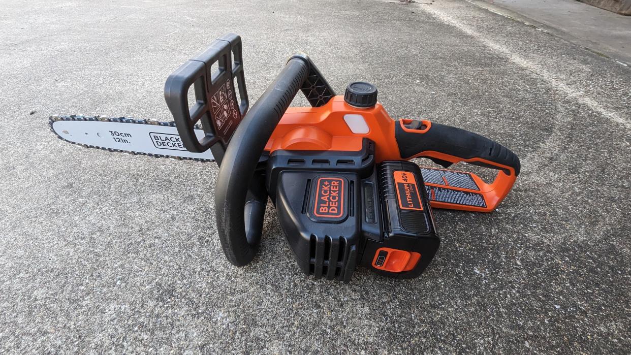  Hero image of the BLACK + DECKER 40V MAX 12-inch Cordless Chainsaw. 