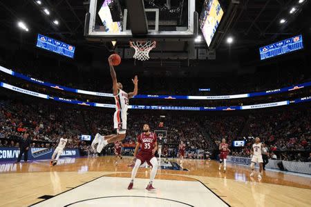 Mar 21, 2019; Salt Lake City, UT, USA; Auburn Tigers guard J'Von McCormick (12) goes up for a shot as New Mexico State Aggies forward Johnny McCants (35) looks on during the first half in the first round of the 2019 NCAA Tournament at Vivint Smart Home Arena. Mandatory Credit: Kirby Lee-USA TODAY Sports