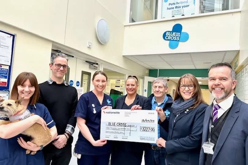 Presentation at Grimsby's Blue Cross Animal Hospital - from left, Nikki Callanan, deputy nurse manager; Rob Low, hospital lead; Natalie Everett, nurse manager; Katie Etheridge, funeral service arranger; Pete Daniel, fundraising volunteer; Caroline Cullum, funeral service arranger and David Emberson, consultant