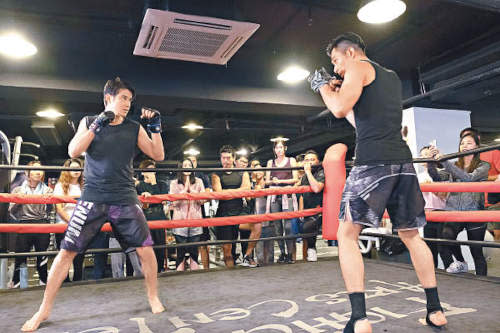 Mario films the boxing ring scene with Pakho Chau on his first day