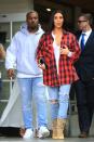 <p>In a red and black flannel, white t-shirt, ripped jeans, Yeezy beige ankle boots, a gold necklace, and lip ring while out to lunch with Kanye West in Calabasas, CA. </p>