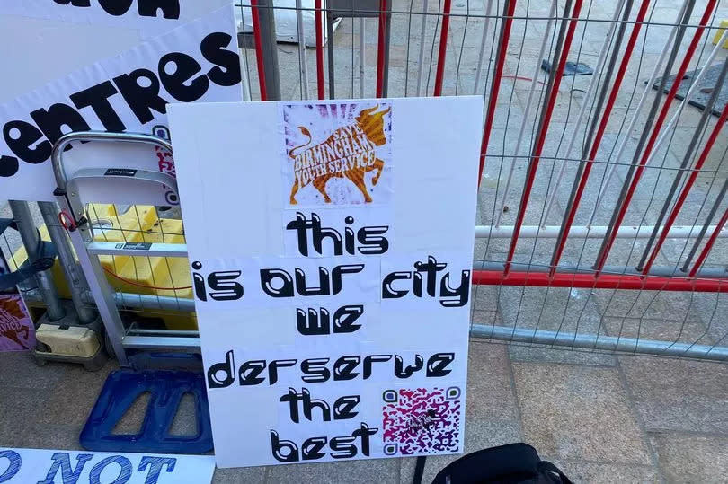 Placards at a protest outside Birmingham Council House during March's budget meeting