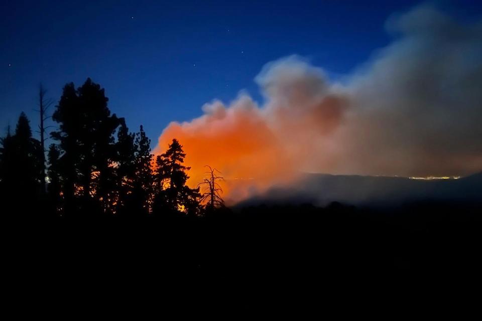 Smoke from the Washburn Fire rises near the lower portion of the Mariposa Grove in Yosemite National Park, Calif., Thursday, July 7, 2022.