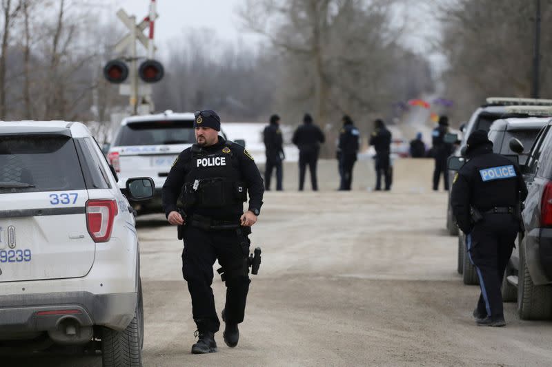 Ontario Provincial Police (OPP) officers guard the site of a dismantled Tyendinaga Mohawk Territory camp, in Tyendinaga