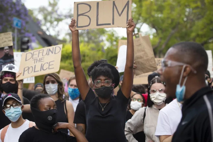 Protesters demonstrate against police brutality outside Los Angeles Mayor Eric Garcetti's home in June 2020.