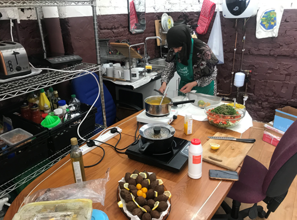 Jomana, a Syrian mother of four, prepares meals for visitors to Dad’s House, a community food bank and support centre in West Brompton (The Independent)