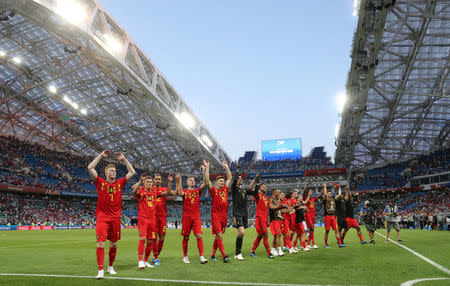 Belgium players celebrate after the match. REUTERS/Marcos Brindicci